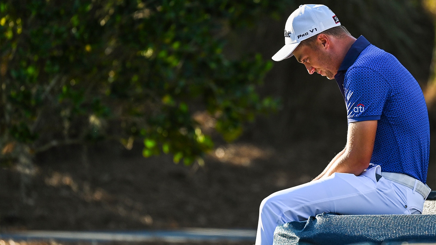 Justin Thomas (NEW Pro V1x) sits and gets...